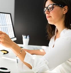 Woman reviewing an Adobe Experience Platform site