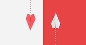Red and white paper airplane flying different directions.