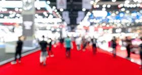Blurry trade show image with Adobe Summit 2024 logo
