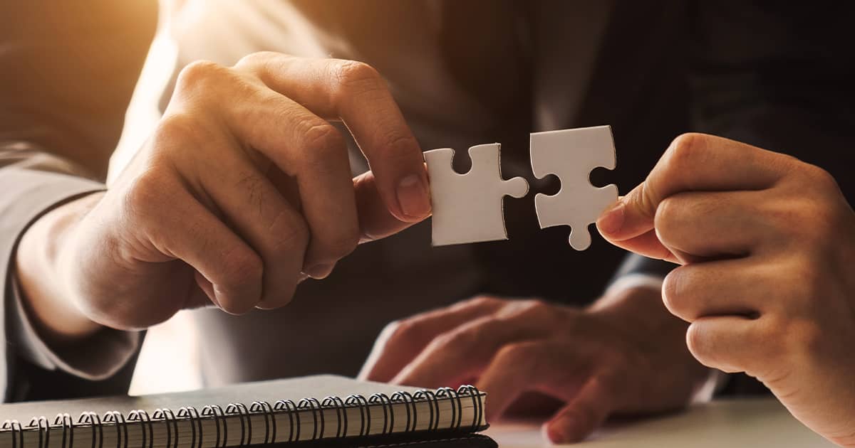  Business people hands connecting jigsaw puzzle representing success