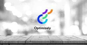 Table and blurred background with Optimizely logo