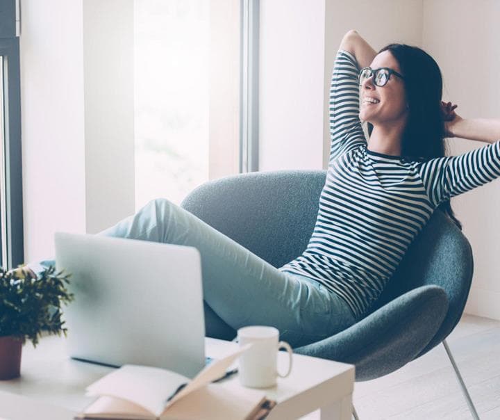 Woman relaxing because she's using Oshyn's Sitecore DevOps service