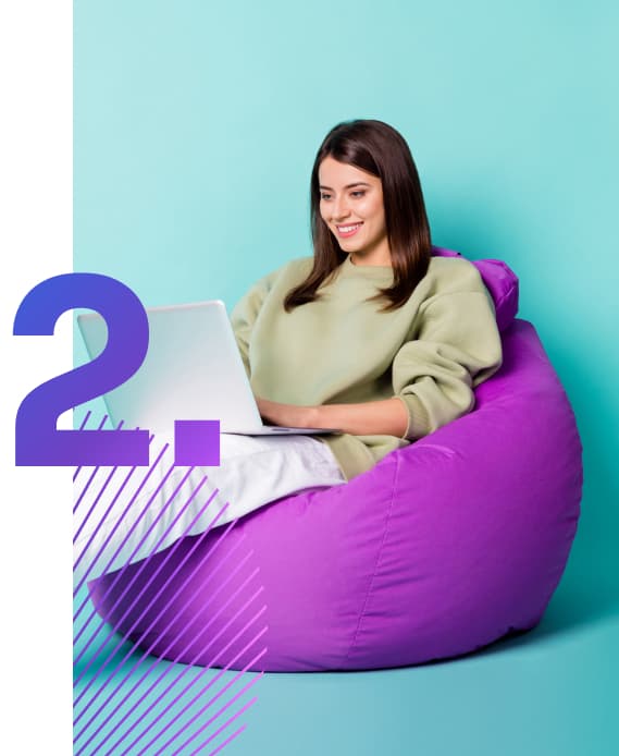 Woman sitting in a beanbag coding